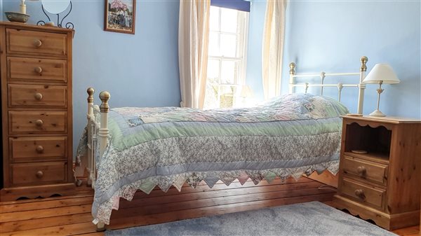 The very pretty blue bedroom in Newt Cottage