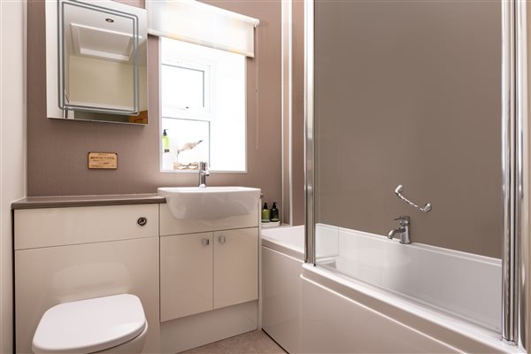 Bathroom with shower over bath