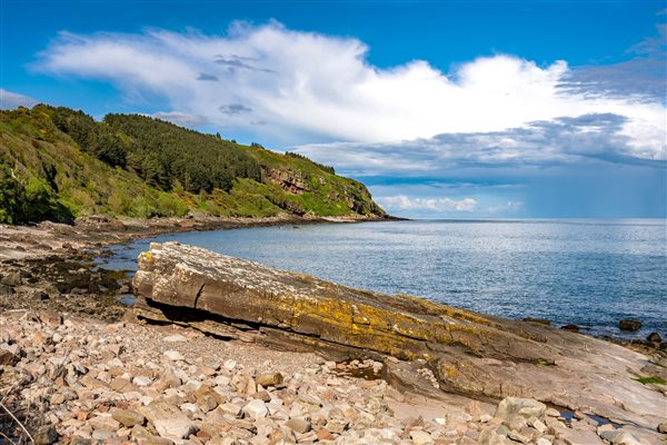 Orroland Bay with rocks, sea, blue sky