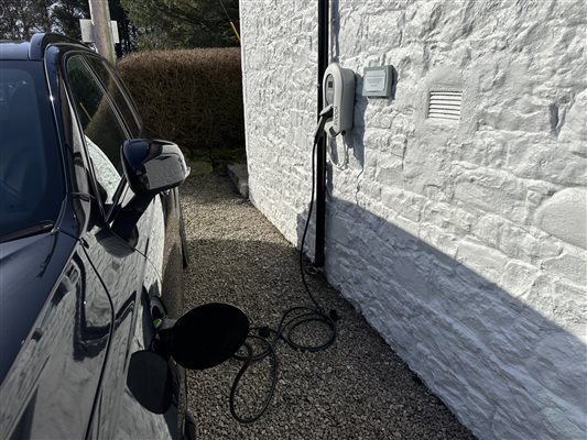 Car plugged into Cutlar's Lodge EV charger