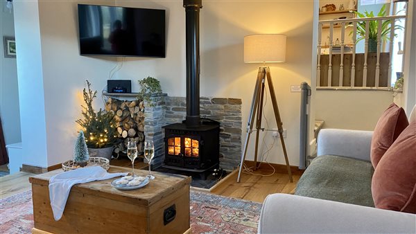 Christmas lounge and lit log burner